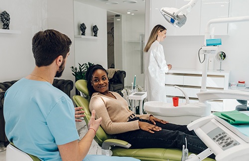 Dentist and patient talking during consultation