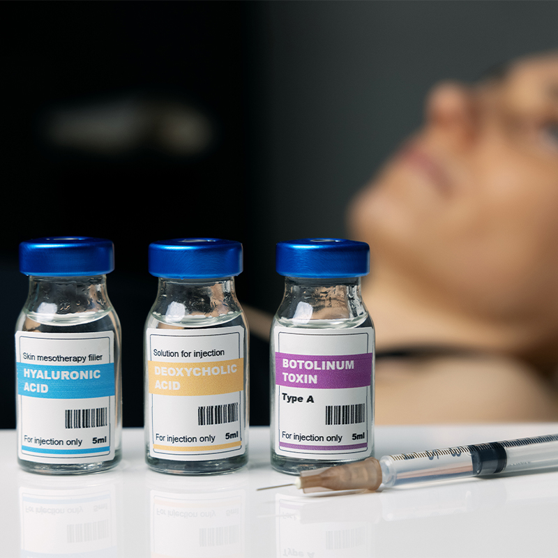 Botulinum toxin and deoxycholic acid in bottles