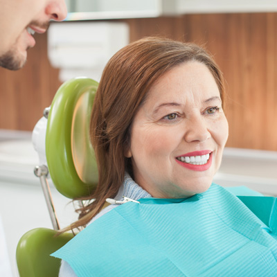 Woman smiling in the dental chair