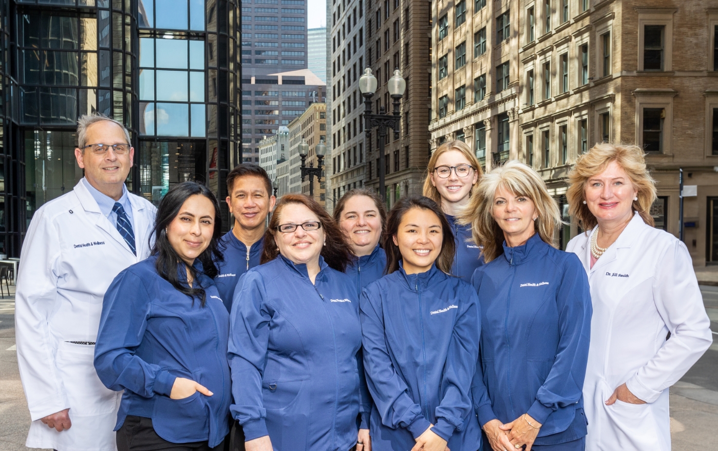 Dentists standing next to dental team