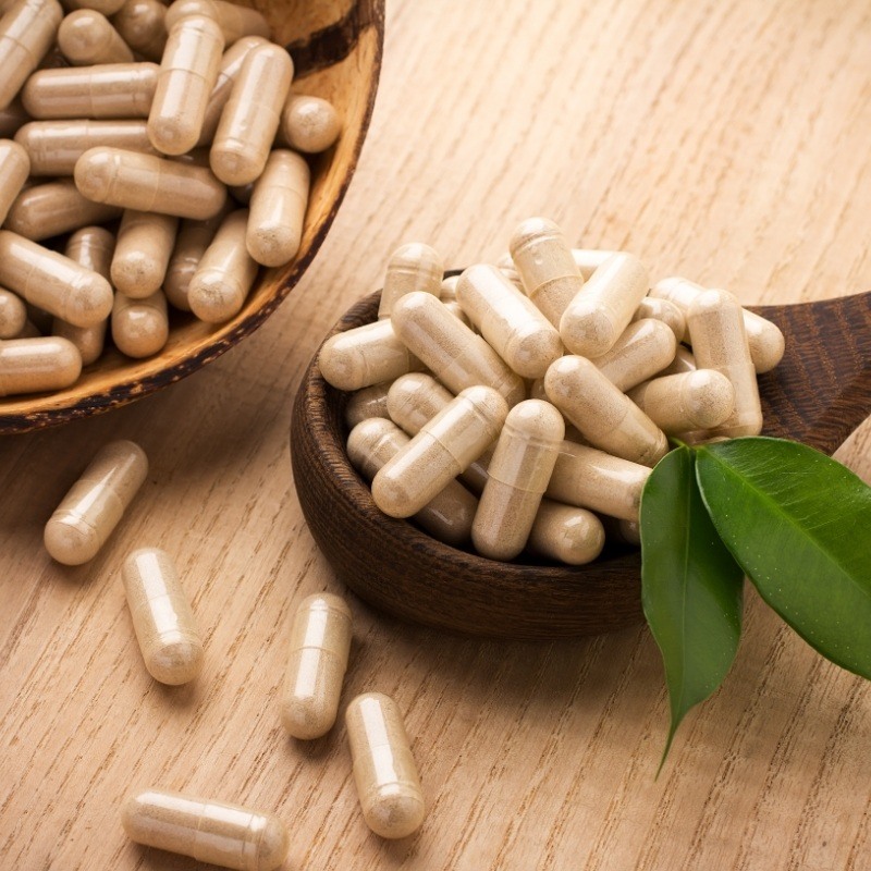 Supplements in a wooden bowl