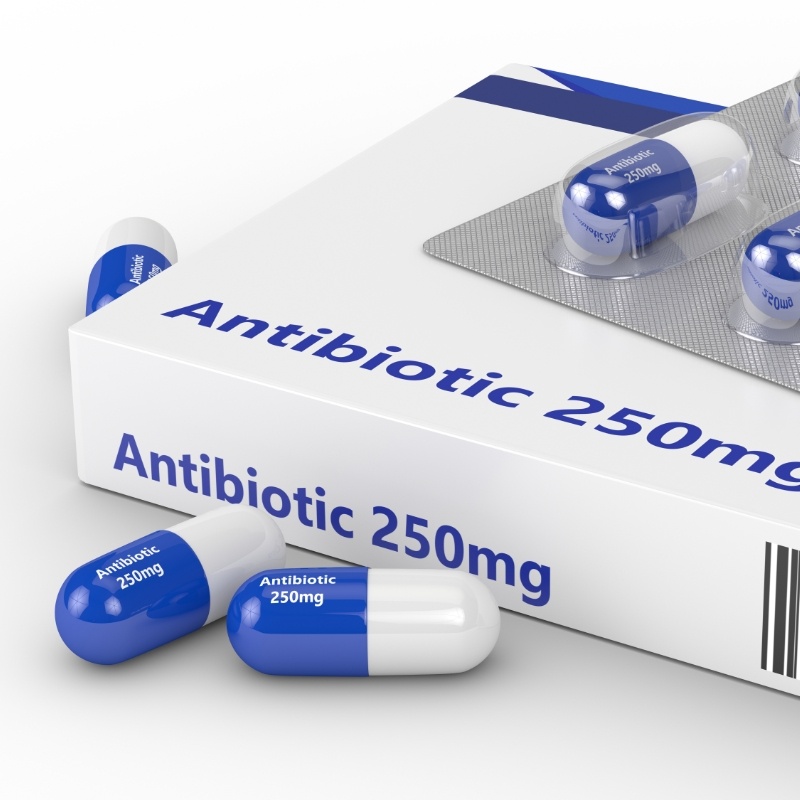 Antibiotics sitting on box and white table