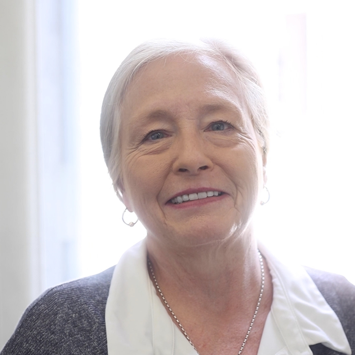 Senior woman with necklace smiling