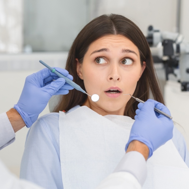 Nervous looking woman in dental chair