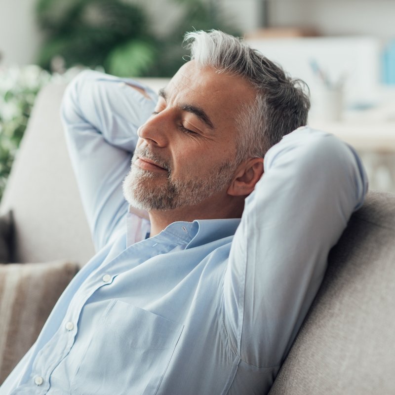 Older man relaxing on a couch