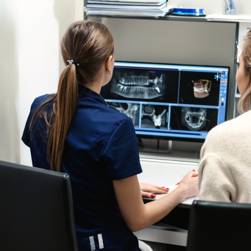 Dentist showing patient some digital X rays