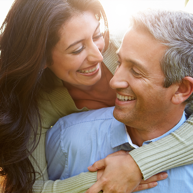 Man and woman smiling at each other