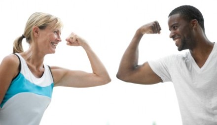 Man and woman flexing arms