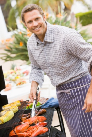 man grilling food for barbecue