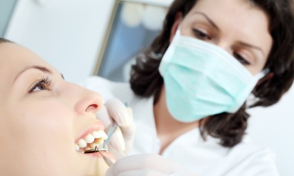 Dentist providing dental care