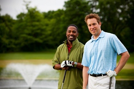 2 golfers on a golf course