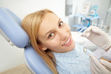 dental patient in chair preparing for her examination